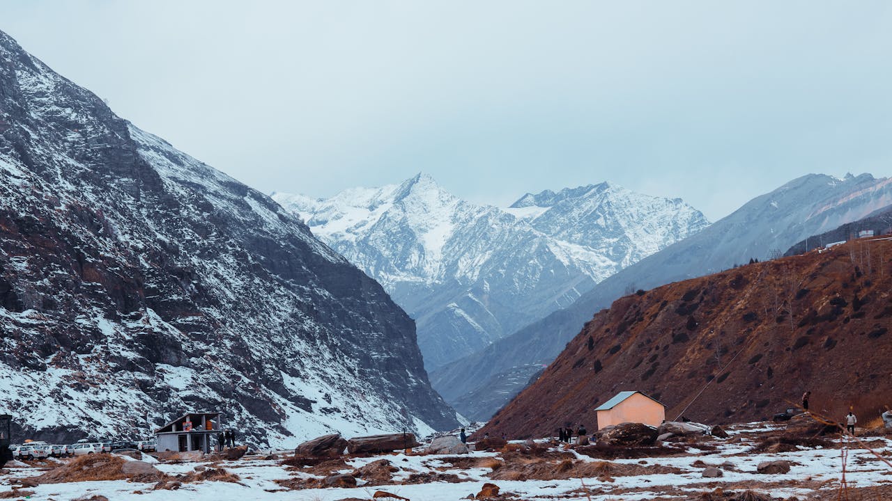 gallery-1 Scenic view of snowcapped Himalayas and village in Sissu Valley, Himachal Pradesh, India.